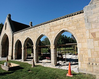 The stone archway, serves as the gateway to a cemetery. Rather than having tombstones, Forest Lawn has only 
flat grave markers. Its founders wanted the cemetery to have the feel of a park.