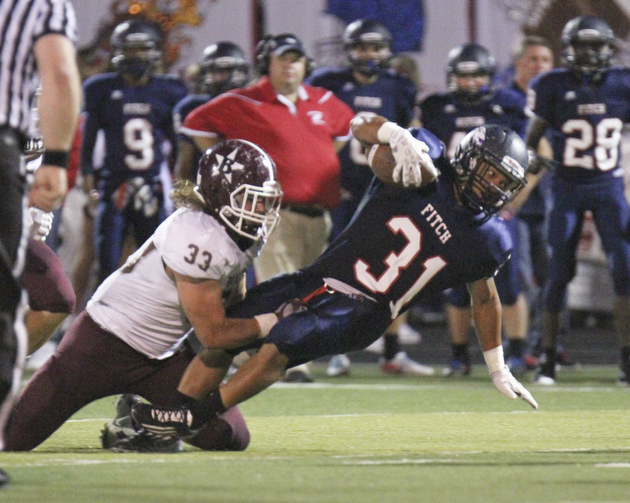 William D Lewis the Vindicator  Fitch's Tyler Hewlett(33) is stopped by Boardman's Evan Croutch(33).