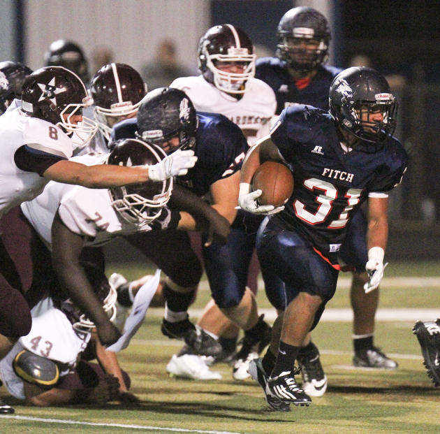 Wlliam D Leiws the Vindicator  Fitch's Tyler Hewitt(31) scampers of yardage against Boardman 9-26-14.