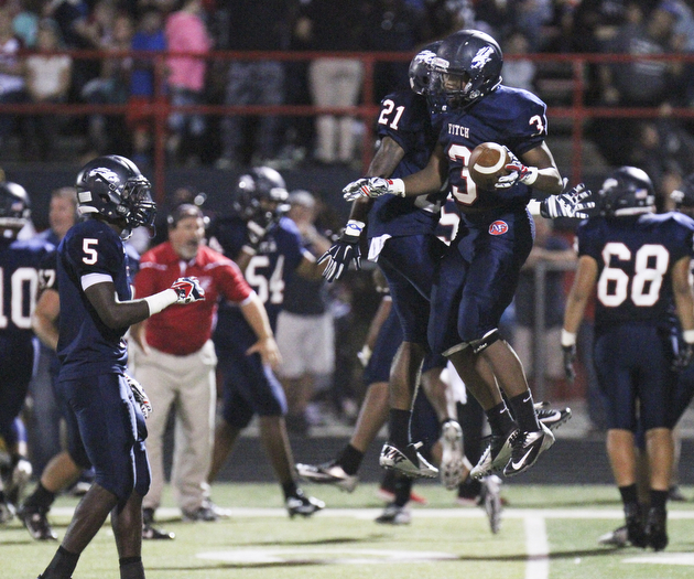 William D Lewis the vindicator Fitch's Mike Pearson(3) reacts after recovering a fumble duuring 1rst half of game with Boardman. With him is Dwayne howell(21).