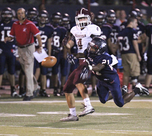 Fitch's Dwayne Howell(21) breaks up a pass intended for Boardman's Joe Cina(4).