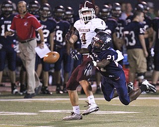 Fitch's Dwayne Howell(21) breaks up a pass intended for Boardman's Joe Cina(4).