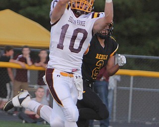 South Range's Greg Dunham (10) makes a catch while being defended by Crestview's Jared Hayden (2) during the first quarter of Friday nights matchup at Crestview High School in Columbiana.   Dustin Livesay  |  The Vindicator  09/26/14  Crestview High School.