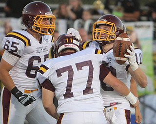 South Range's Greg Dunham (10) celebrates with his teammates Ryan Sympson (65) and Evan Schaefer (77) during the first quarter of Friday nights matchup against Crestview at Crestview High School in Columbiana.   Dustin Livesay  |  The Vindicator  09/26/14  Crestview High School.