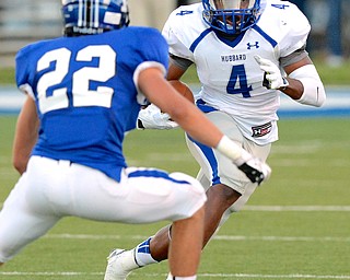 Jeff Lange | The Vindicator  Hubbard junior running back George Hill runs for a gain past Poland's Nick Meris (22) early in the first quarter of Friday night's matchup at Dave Pavlansky Field