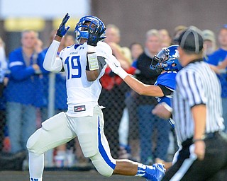 Jeff Lange | The Vindicator  Eagles' wide receiver Isaiah Scott (19) catches a touchdown pass in the first quarter making the score 13-0 over Poland during Friday night's game in Poland.