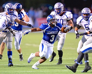 Jeff Lange | The Vindicator  Poland Seminary's Marlon Ramirez makes his way through a host of Eagles' defenders in the first half of the Bulldogs' matchup with Hubbard, Friday night at Dave Pavlansky Field.