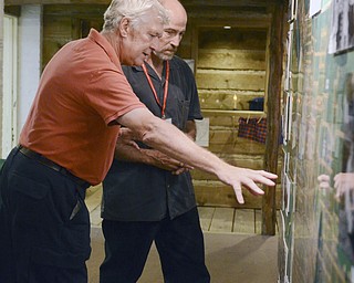 .Tom Rookey of Sharon (left), Pennsylvania discusses the layout of Youngstown according to the large map of the city with Arms Family Museum employee Joe Kachurek during a guided tour of the museum Saturday, Sept. 27, 2014.  The Mahoning Valley Historical Society honored military personnel by offering free tours of the museum on Saturday, Sept. 27, 2014.
