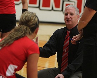 Youngstown State head volleyball coach Mark Hardaway goes through plays with his team during a timeout during Saturday afternoons matchup against Wright State at the Beeghly Center.