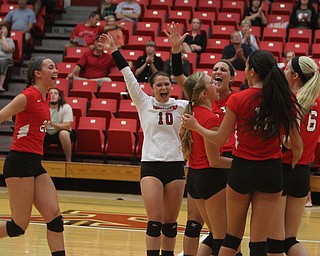 The Youngstown State volleyball team celebrates after winning Saturday afternoons matchup against Wright State at the Beeghly Center.