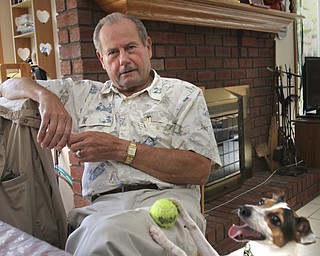William D. Lewis the Vindicator  GM retiree Jim Kralik relaxes  in his Hubbard Twp. home.