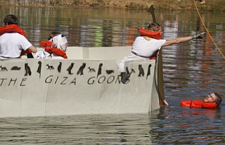       ROBERT K. YOSAY  | THE VINDICATOR..Whoops  as the Giza Goonies lost track of the rope used for propolsion  Tod Peterson  entered the water and had to help the boat back to the line..The Annual Raider  Regatta done annually by 10th grade students at Memorial Park behind the old high School ...-30-