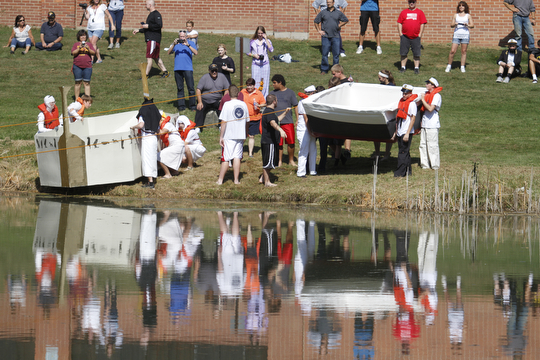        ROBERT K. YOSAY  | THE VINDICATOR..Fun Reflection as Giza Goonies and the Titanic Part 2 enter the water....The Annual Raider  Regatta done annually by 10th grade students at Memorial Park behind the old high School ...-30-