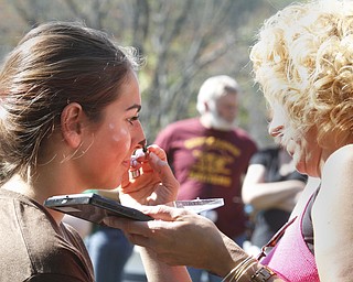        ROBERT K. YOSAY  | THE VINDICATOR..putting on a bit of make-up for her part in the boat - is Taylor Naples as her mom Janine applys the make up..The Annual Raider  Regatta done annually by 10th grade students at Memorial Park behind the old high School ...-30-