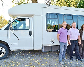 Jeff Lange | The Vindicator  Struthers Mayor Terry Stocker (center) stands by the city's senior van with Sean Dietz (left) and Shirley Sepesy (right). The van was purchased from the village of Lowellville and is planned on being replaced some time in the summer of 2015.