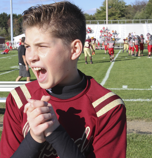 William D. Lewis the Vindicator  Dakota rabowy, Liberty 8th grade is the first boy in the district to be a cheerleader. He is shown cheering at a football game 9-25-14 in Liberty.