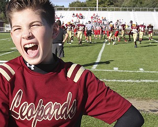 William D. Lewis the Vindicator  Dakota rabowy, Liberty 8th grade is the first boy in the district to be a cheerleader. He is shown cheering at a football game 9-25-14 in Liberty.