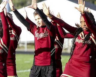 William D. Lewis the Vindicator  Dakota Hrabowy, Liberty 8th grade is the first boy in the district to be a cheerleader. He is shown cheering at a football game 9-25-14 in Liberty.