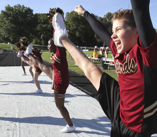 William D. Lewis the Vindicator  Dakota rabowy, Liberty 8th grade is the first boy in the district to be a cheerleader. He is shown cheering at a football game 9-25-14 in Liberty.