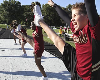 William D. Lewis the Vindicator  Dakota rabowy, Liberty 8th grade is the first boy in the district to be a cheerleader. He is shown cheering at a football game 9-25-14 in Liberty.