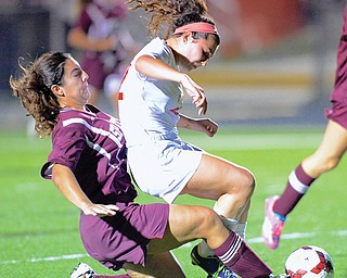 Canfield’s Anita Mancini, right, and Boardman’s Camille Holzschuh colide in the first half as they fight for the ball Monday night. Mancini scored three goals in Canfield’s 8-0 victory at Bob Dove Field.