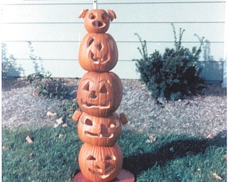 21.  The totem pole of jack-o'-lanterns was made by Trish, Mark and Lou Rendes in 1987. Submitted by Lou of Mineral Ridge.