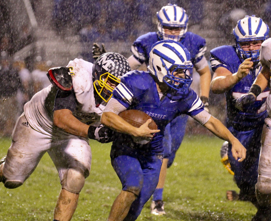 William D Lewis the vindicator  WR's Evan Nesbitt(3) eludes McDonald's Albert Yates(61) during 1rst half action 10-3-14 at WR.