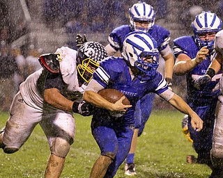 William D Lewis the vindicator  WR's Evan Nesbitt(3) eludes McDonald's Albert Yates(61) during 1rst half action 10-3-14 at WR.