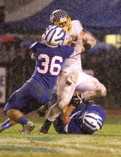 William D Lewis the vindicator   McDonald's Jake Reckard(9) is stopped by WR's Kyle Hilles(36)during 1rst half action 10-3-14 at WR.