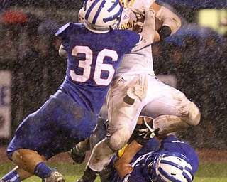 William D Lewis the vindicator   McDonald's Jake Reckard(9) is stopped by WR's Kyle Hilles(36)during 1rst half action 10-3-14 at WR.