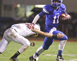 William D Lewis the vindicator  WR's Joe Falasca(11) eludes McDonald's Jake Reckard(9) during 1rst haldf action 10-3-14 at WR.