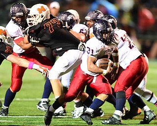 MASSILLON, OHIO - OCTOBER 3, 2014: Tyler Hewlett #31 of Fitch breaks away from the pack on his way into the end zone to score on a 23 yard run during the 1st half of Friday nights OHSAA football game at Massillon Washington High School. (Photo by David Dermer/Youngstown Vindicator)