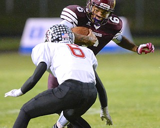 Jeff Lange | The Vindicator  Liberty's Lynn Bowden (facing) runs for yards past Jefferson's Thomas Bevins during first half action in Liberty, Friday night.