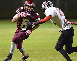 Jeff Lange | The Vindicator  Liberty's Lynn Bowden looks into the eyes of his defender James Jackson in the first quarter of Friday night's game in Liberty.