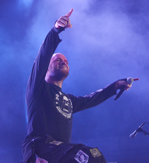 Katie Rickman | The Vindicator.Ivan Moody, the lead singer of Five Finger Death Punch points at the crowd as they sing along to a song during the concert at the Covelli Centre Saturday, Oct. 4, 2014.