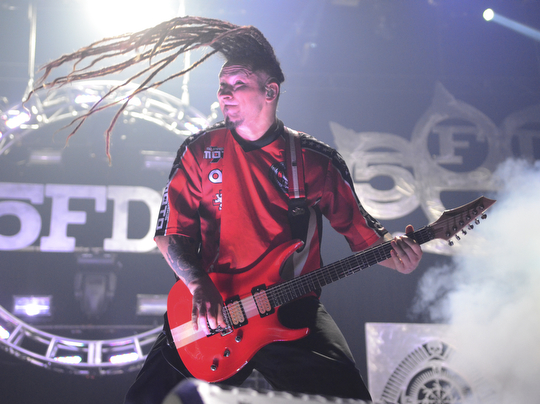 Katie Rickman | The Vindicator.Zoltan Bathory, guitarist for Five Finger Death Punch head bangs during a song at the Covelli Centre in Youngstown Saturday, Oct. 4, 2014.