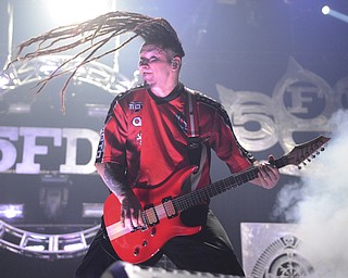 Katie Rickman | The Vindicator.Zoltan Bathory, guitarist for Five Finger Death Punch head bangs during a song at the Covelli Centre in Youngstown Saturday, Oct. 4, 2014.