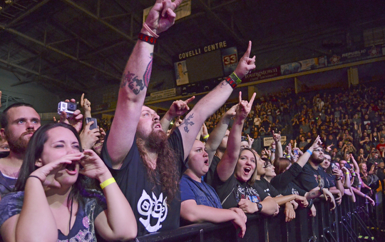 Katie Rickman | The Vindicator.The crowds reacts, throwing their hands in the air at the sold out show for Five Finger Death Punch at the Covelli Centre in Youngstown on Saturday, Oct. 4, 2014.