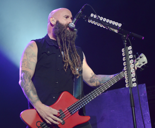 Katie Rickman | The Vindicator.Chris Kael of Five Finger Death Punch  plays bass guitar and sings at the sold out show a the Covelli Centre on Saturday, Oct. 4, 2014.