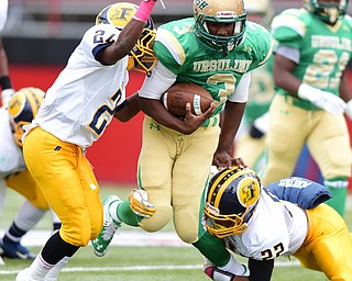 YOUNGSTOWN, OHIO - OCTOBER 4, 2014: Kimauni Johnson #3 of Ursuline is tackled by James Jackson #24 and Terrell Atkins #22 of Farrell during the 1st half of Saturday afternoon game at Stambaugh Stadium. (Photo by David Dermer/Youngstown Vindicator)