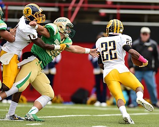YOUNGSTOWN, OHIO - OCTOBER 4, 2014: Terrell Atkins #22 of Farrell runs to the outside behind the block of Marcus Mccoy #14 on Vito Penza #39 of Ursuline during the 1st half of Saturday afternoon game at Stambaugh Stadium. (Photo by David Dermer/Youngstown Vindicator)
