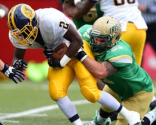 YOUNGSTOWN, OHIO - OCTOBER 4, 2014: John Jackson #2 of Farrell is tackled in the backfield by Robbie Beardman #51 during the 1st half of Saturday afternoon game at Stambaugh Stadium. (Photo by David Dermer/Youngstown Vindicator)