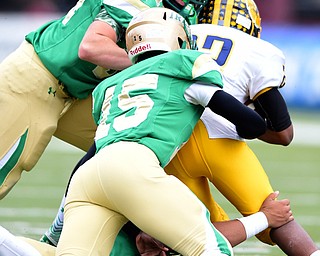 YOUNGSTOWN, OHIO - OCTOBER 4, 2014: Terrell Atkins #22 of Farrell is gang tackled by Tyler Leonard #54, DaWa'lin Childs #15 and Devin Matthews #65 of Ursuline during the 1st half of Saturday afternoon game at Stambaugh Stadium. (Photo by David Dermer/Youngstown Vindicator)