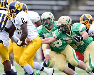 YOUNGSTOWN, OHIO - OCTOBER 4, 2014: John Jackson #2 of Farrell is chased down by Tyler Leonard #54 of Ursuline during the 1st half of Saturday afternoon game at Stambaugh Stadium. (Photo by David Dermer/Youngstown Vindicator)