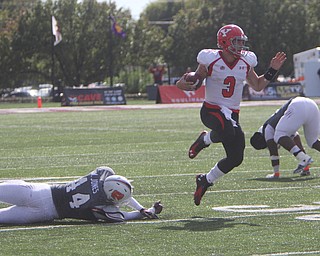 Youngstown State's Dante Nania (3) avoids a tackle by Missouri State's Alexz Jones (44) during the first half of Saturday afternoons matchup at Missouri State University.  Dustin Livesay  |  The Vindictor  10/4/14 Missouri.
