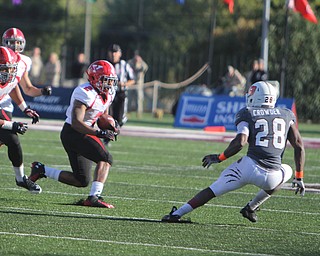 Youngstown State's Tre Moore (2) returns an interception while avoiding a tackle by Missouri State's Calan Cowder (28) during the second half of Saturday afternoons matchup at Missouri State University.  Dustin Livesay  |  The Vindictor  10/4/14 Missouri.