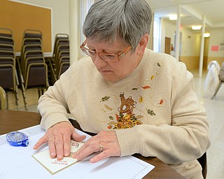 Jeff Lange | The Vindicator  Lucy Winkler of Girard makes a card to send to Akron Childrens' Hospital, Saturday afternoon at St. James Episcopal Church in Boardman.