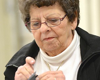 Jeff Lange | The Vindicator  Millie Larney of Liberty sits down and makes a bat treat box out of black construction paper, Saturday afternoon at St. James Episcopal Church.