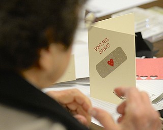 Jeff Lange | The Vindicator  Millie Larney of Liberty looks at her completed get well card for the kids of Akron Childrens' Hospital, Saturday afternoon at St. James Episcopal Church in Boardman.