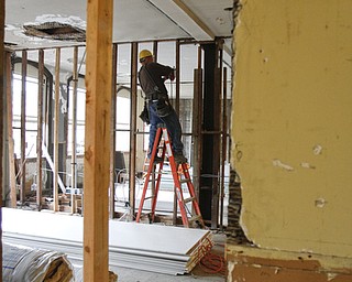        ROBERT K. YOSAY  | THE VINDICATOR..Rich Giardina  works on a wall in the upper floor that will be made into offices.....Warrens' TECH belt energy innovation center on  courthouse square, right  next door to the Wean Foundation offices..the old Kresge'  business..-30-
